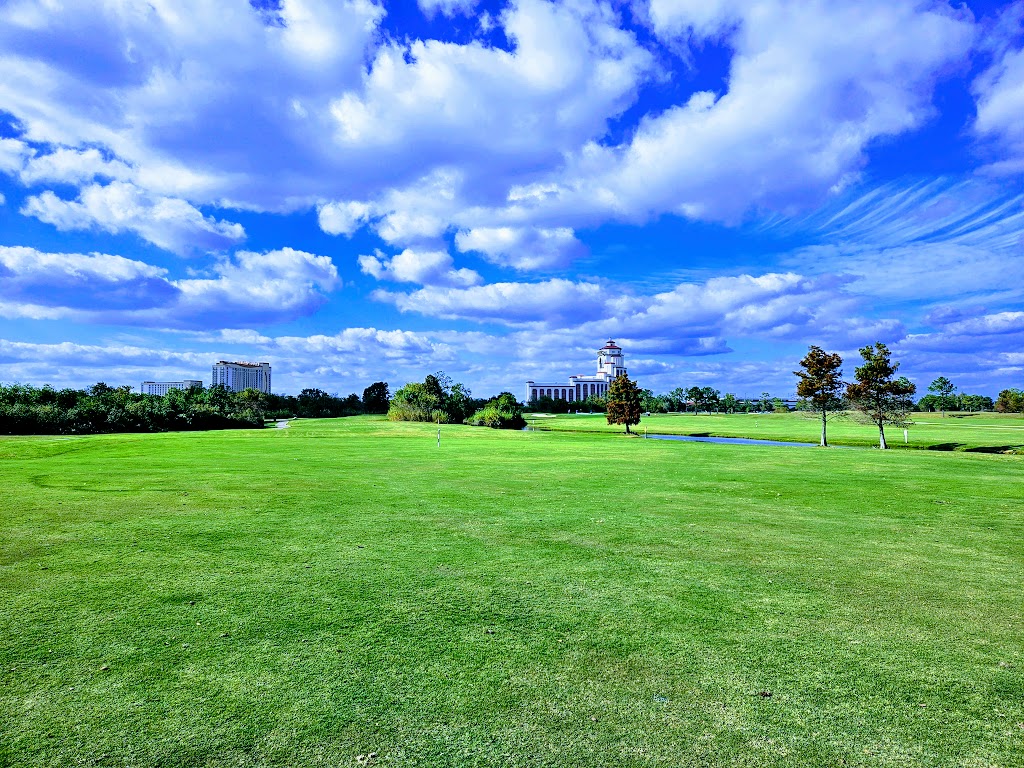 Panoramic view of a lush green golf course at Contraband Bayou Golf Club. Smooth
