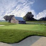 Panoramic view of a lush green golf course at Cooper's Hawk Golf Course. Smooth