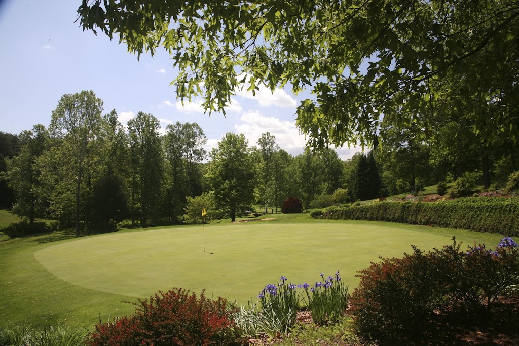 Panoramic view of a lush green golf course at Copper Cove Golf Club. Smooth