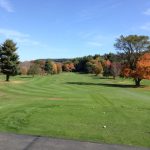 Panoramic view of a lush green golf course at Copper Hill Golf Club. Smooth