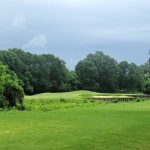 Panoramic view of a lush green golf course at Copper Mill Golf Club. Smooth
