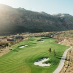 Panoramic view of a lush green golf course at Copper Rock Golf Course. Smooth