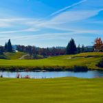 Panoramic view of a lush green golf course at Copper Valley Golf Club. Smooth
