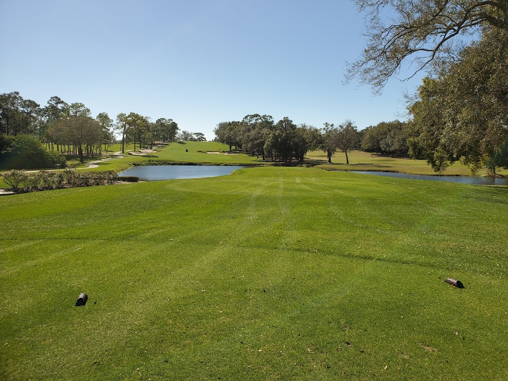 Panoramic view of a lush green golf course at Copperhead Course. Smooth