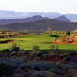 Panoramic view of a lush green golf course at Coral Canyon Golf Course. Smooth