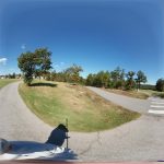 Panoramic view of a lush green golf course at Coronado Golf Course. Smooth