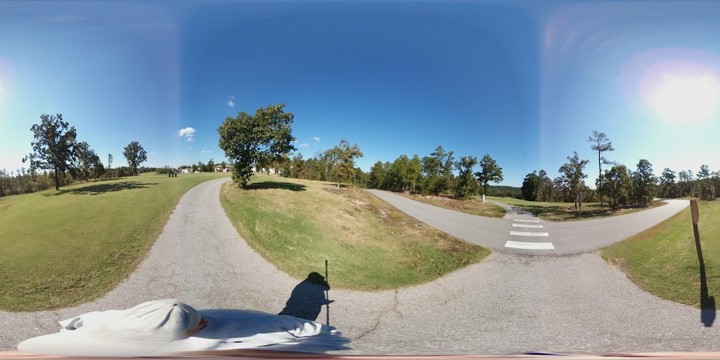 Panoramic view of a lush green golf course at Coronado Golf Course. Smooth