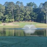 Panoramic view of a lush green golf course at Cortez Golf Course. Smooth