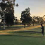 Panoramic view of a lush green golf course at Costa Mesa Country Club. Smooth