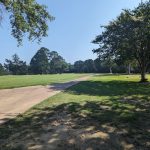 Panoramic view of a lush green golf course at Country Club of Canton. Smooth