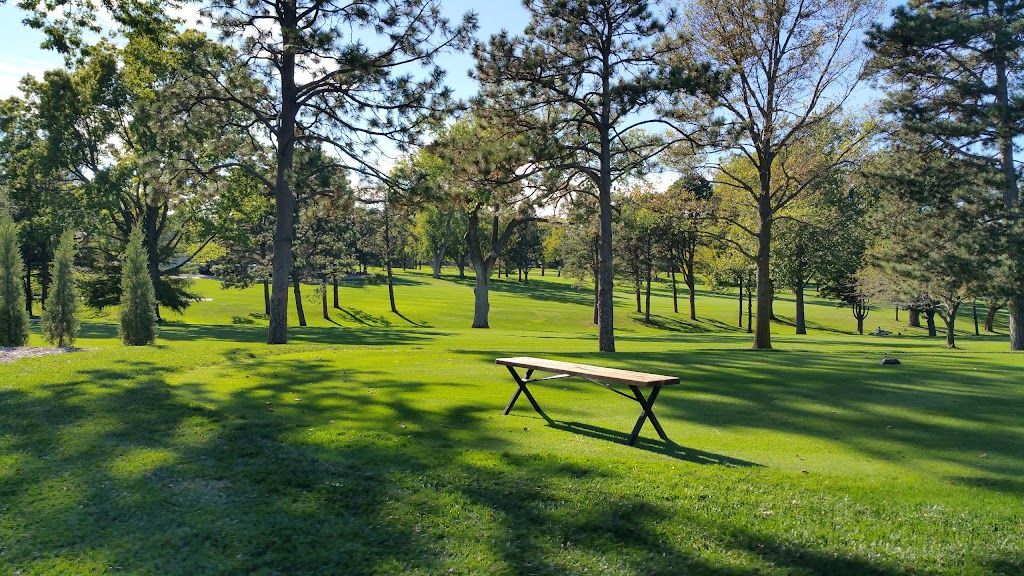 Panoramic view of a lush green golf course at Country Club of Lincoln. Smooth