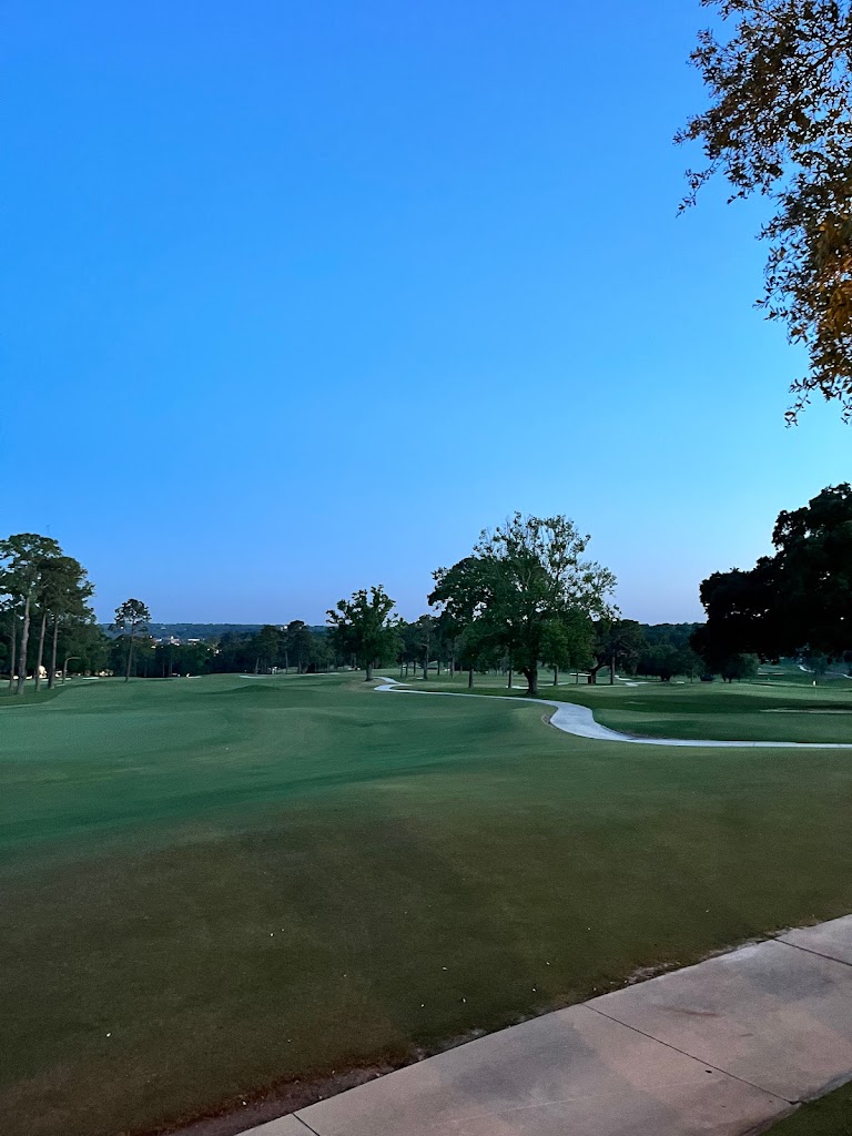Panoramic view of a lush green golf course at Country Club of Mobile. Smooth