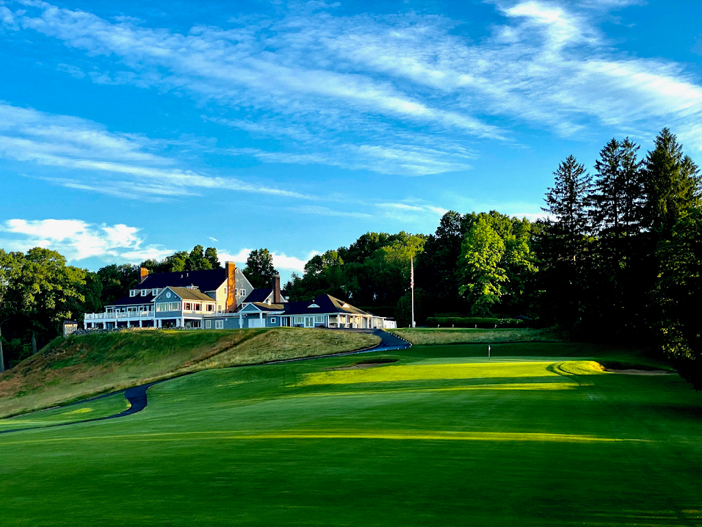 Panoramic view of a lush green golf course at Country Club of Waterbury. Smooth