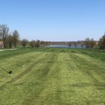 Panoramic view of a lush green golf course at Country Creek Golf Club. Smooth
