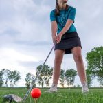 green grass with the flag in the hole.