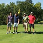 green grass with the flag in the hole.