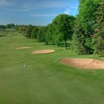 Panoramic view of a lush green golf course at Countryside Golf Club. Smooth