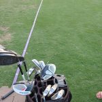 green grass with the flag in the hole.