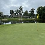 green grass with the flag in the hole.