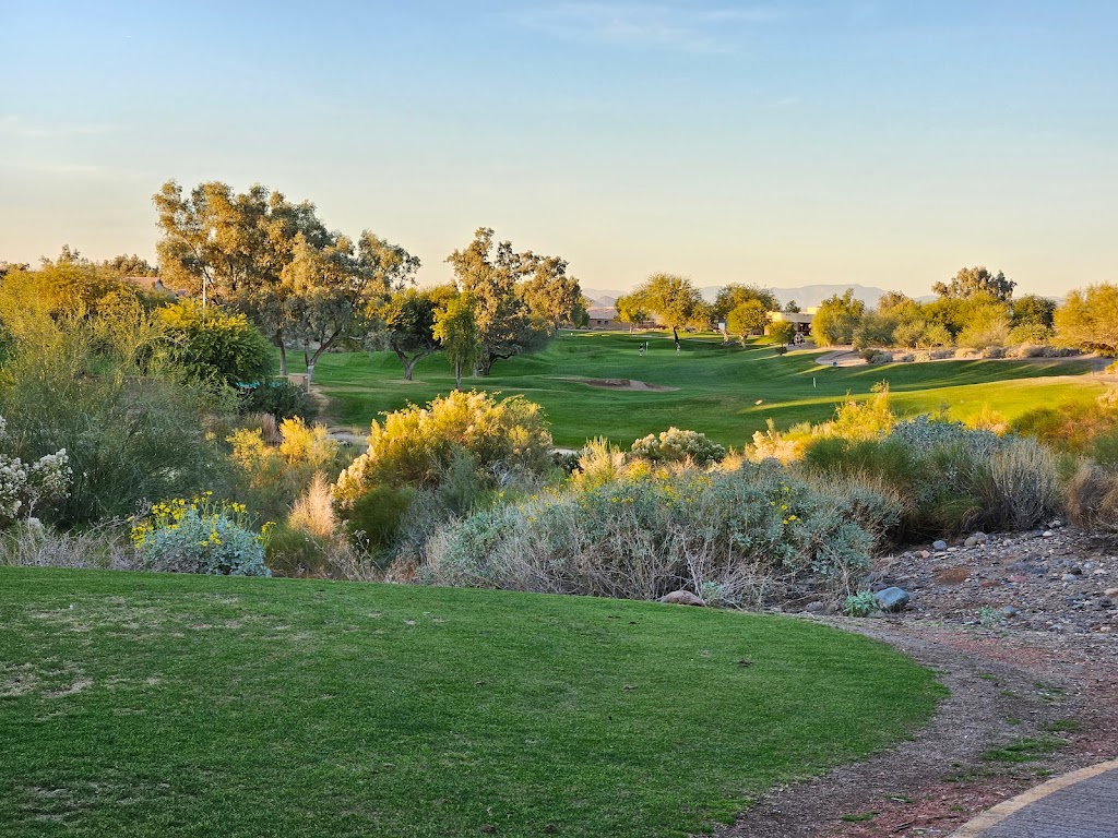 Panoramic view of a lush green golf course at Coyote Lakes Golf Club. Smooth