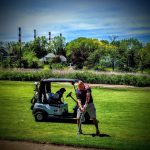 green grass with the flag in the hole.