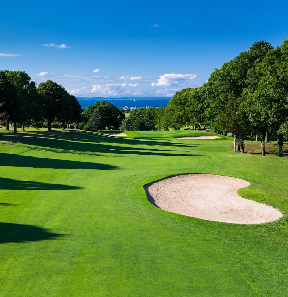 Panoramic view of a lush green golf course at Crab Meadow Golf Course. Smooth