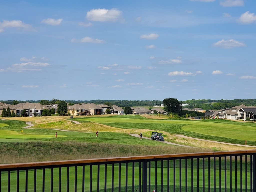 Panoramic view of a lush green golf course at Creekmoor Golf Course. Smooth