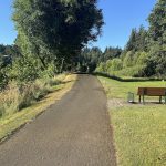 Panoramic view of a lush green golf course at Creekside Golf Club. Smooth