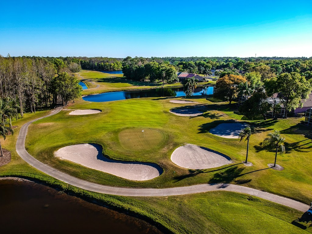 Panoramic view of a lush green golf course at Crescent Oaks Golf Club. Smooth