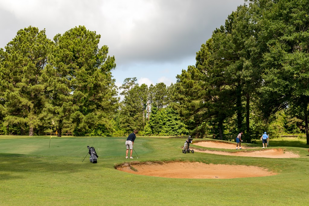 Panoramic view of a lush green golf course at Crooked Hollow Golf Club. Smooth