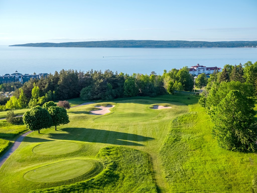 Panoramic view of a lush green golf course at Crooked Tree Golf Club. Smooth