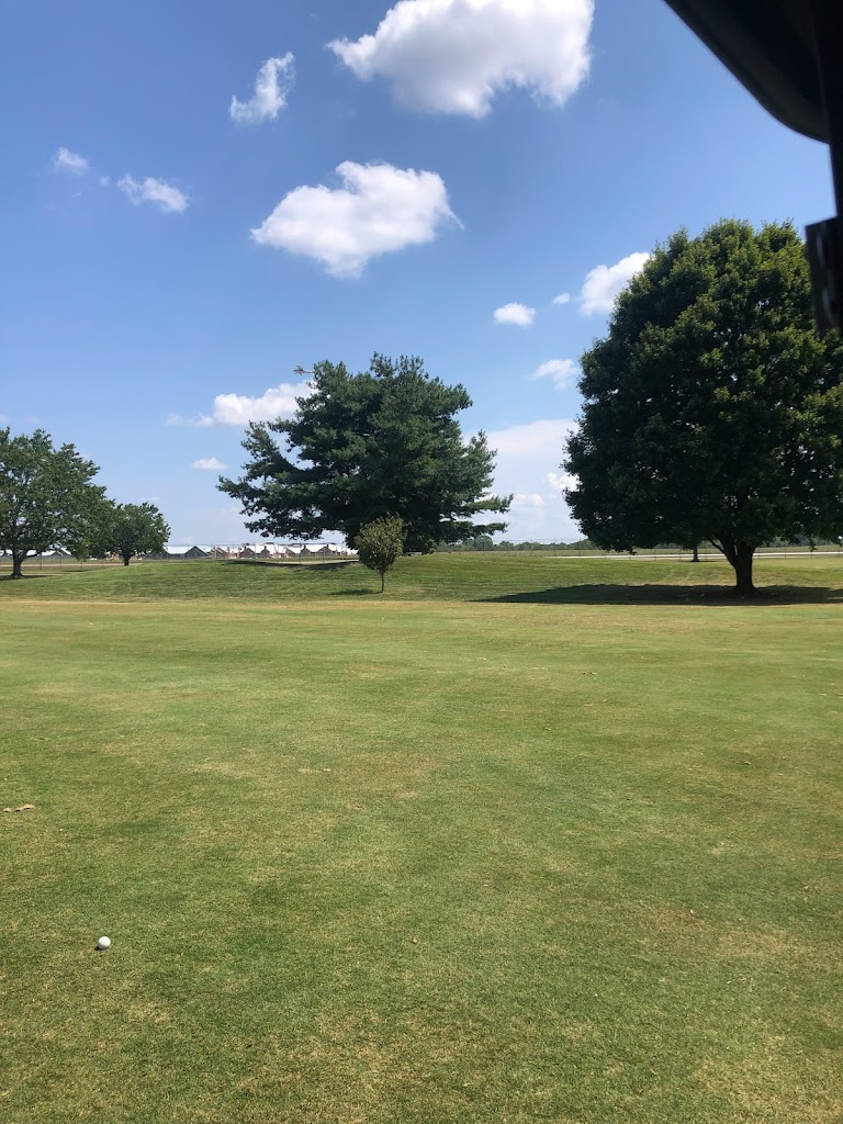 Panoramic view of a lush green golf course at Cross Winds Golf Course. Smooth