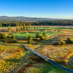Panoramic view of a lush green golf course at Crosswater Golf Course. Smooth