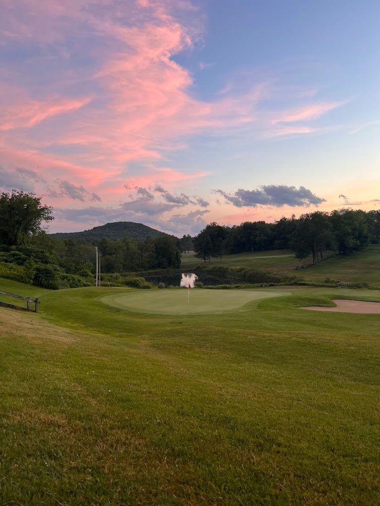 Panoramic view of a lush green golf course at Crown Point Country Club. Smooth