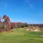 Panoramic view of a lush green golf course at Crystal Lake Golf Club. Smooth