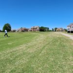 Panoramic view of a lush green golf course at Crystal Lake Golf & Country Club. Smooth