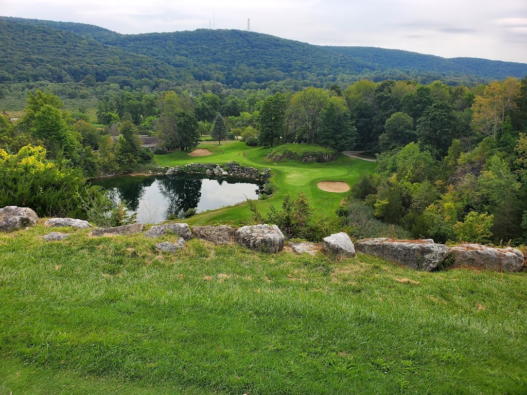 Panoramic view of a lush green golf course at Crystal Springs Golf Club. Smooth