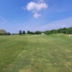 Panoramic view of a lush green golf course at Culver Academies Golf Course. Smooth
