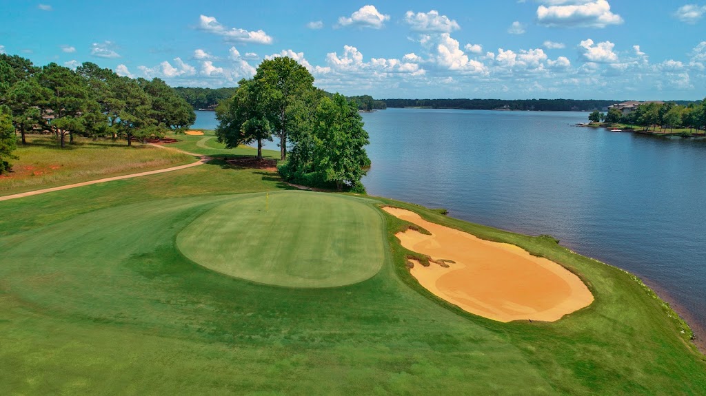 Panoramic view of a lush green golf course at Cuscowilla on Lake Oconee. Smooth