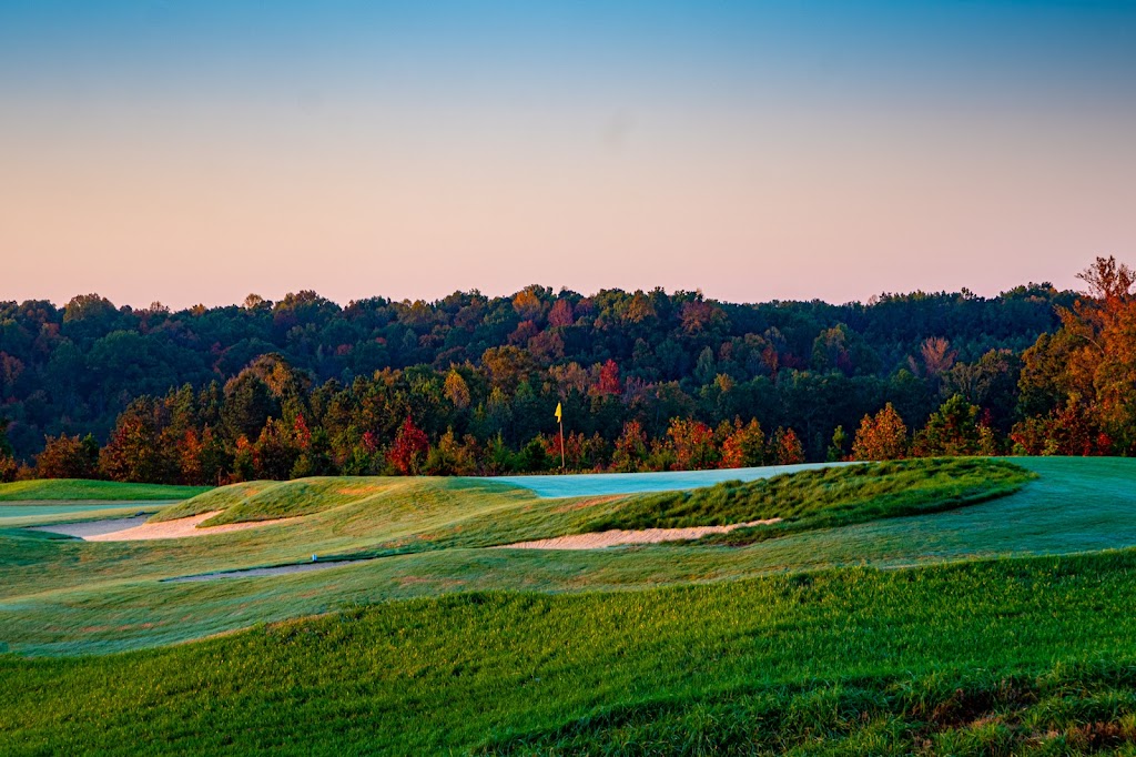 Panoramic view of a lush green golf course at Cutalong Master Planned Golf Community. Smooth