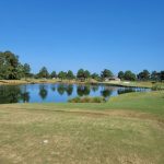 Panoramic view of a lush green golf course at Cutter Creek Golf Club. Smooth