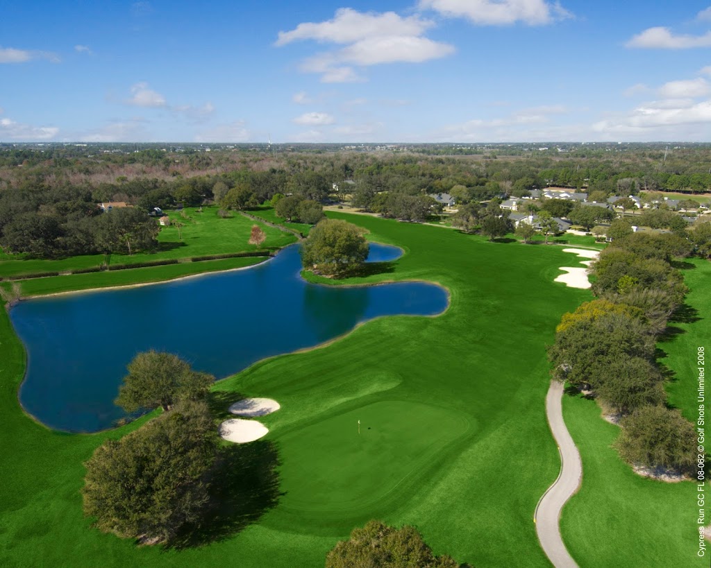 Panoramic view of a lush green golf course at Cypress Run Golf Club. Smooth