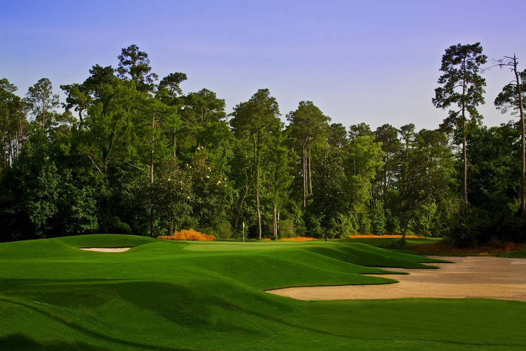 Panoramic view of a lush green golf course at Cypresswood Golf Club. Smooth