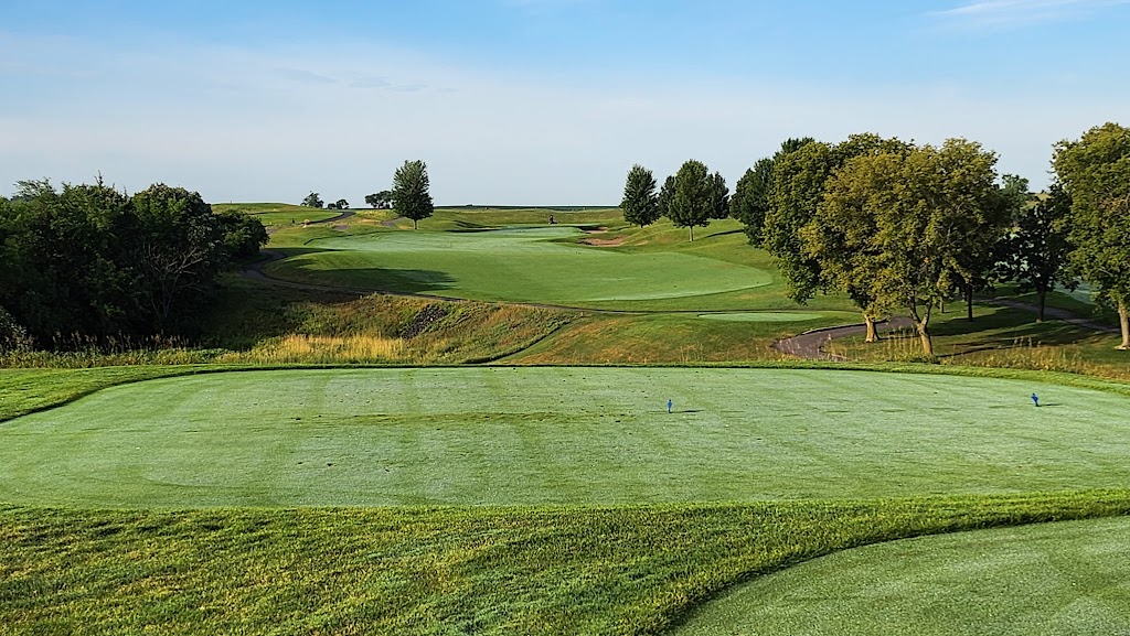 Panoramic view of a lush green golf course at Dacotah Ridge Golf Club. Smooth