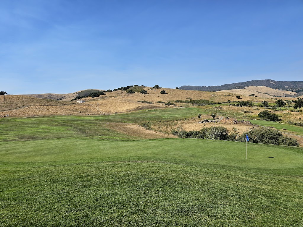 Panoramic view of a lush green golf course at Dairy Creek Golf Course. Smooth