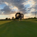 Panoramic view of a lush green golf course at Dakota Landing Golf Course. Smooth