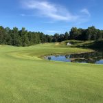 Panoramic view of a lush green golf course at Dale Hollow Golf Course. Smooth