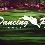 Panoramic view of a lush green golf course at Dancing Rabbit Golf Club. Smooth