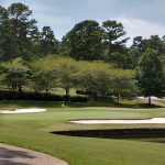 Panoramic view of a lush green golf course at DeSoto Golf Course. Smooth