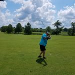 green grass with the flag in the hole.
